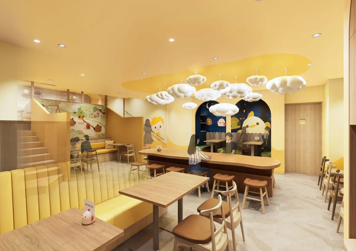 雲の形の照明が印象的な、ゆったりとしたカフェスペースの内装イメージ