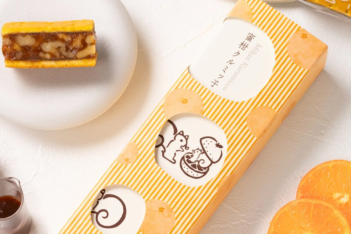 蜜柑から顔を出す子リスくんが描かれたパッケージデザイン